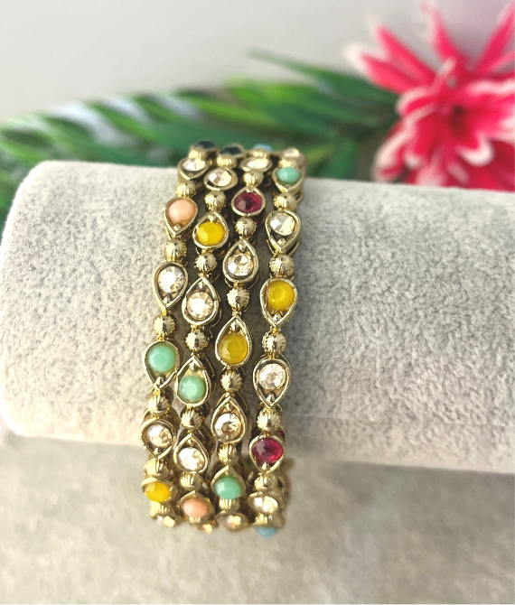 Four antique gold multicolour stone studded kangan